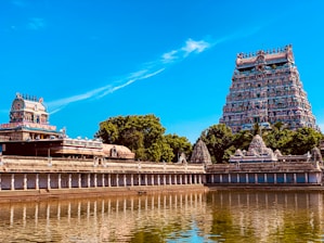 a large body of water next to a tall building