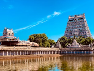 a large body of water next to a tall building