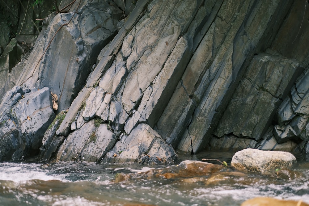 a stream of water running between two large rocks