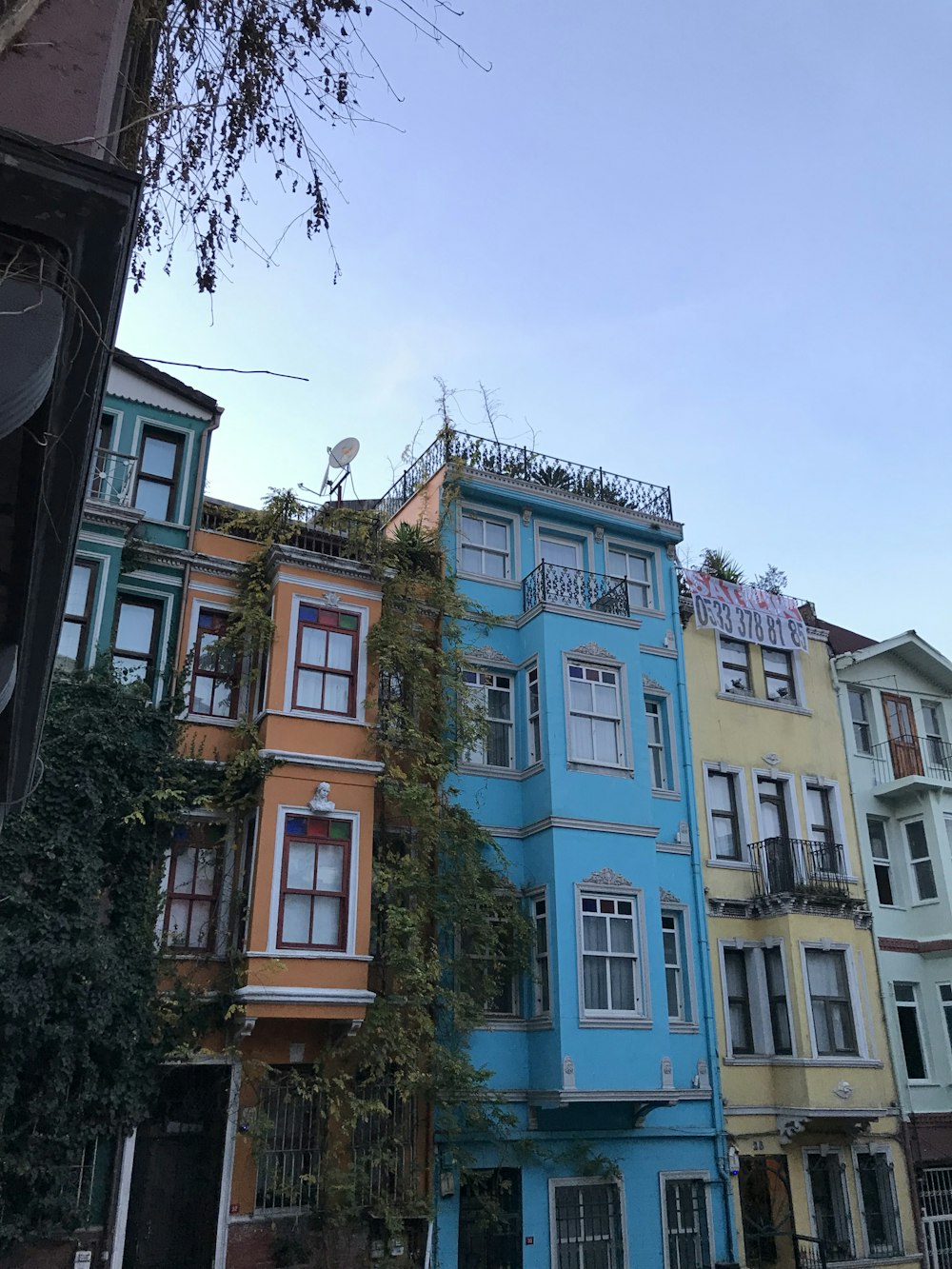 a row of multi - colored buildings in a city