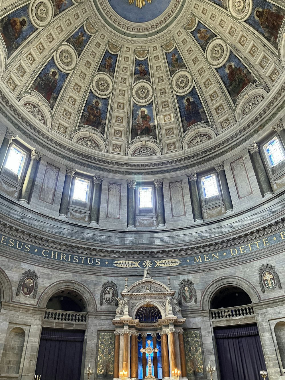 a church with a domed ceiling and stained glass windows