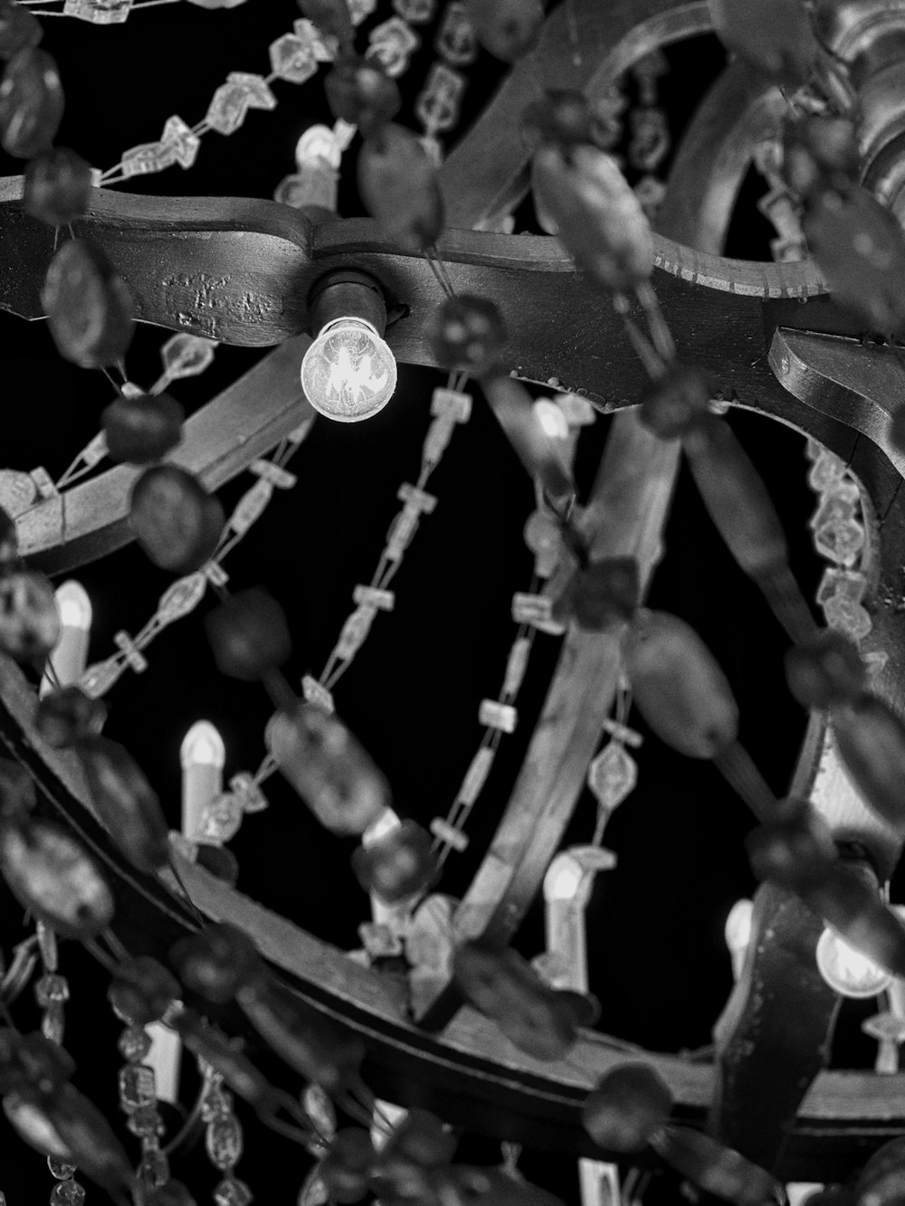 a black and white photo of a chandelier