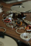 Various electronic spare parts including resistors, capacitors, and connectors spread out on a white surface.
