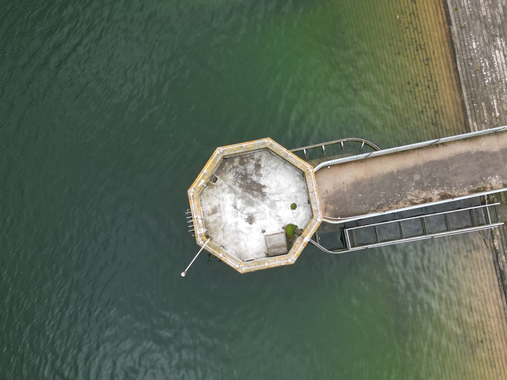 an aerial view of a concrete structure in the water