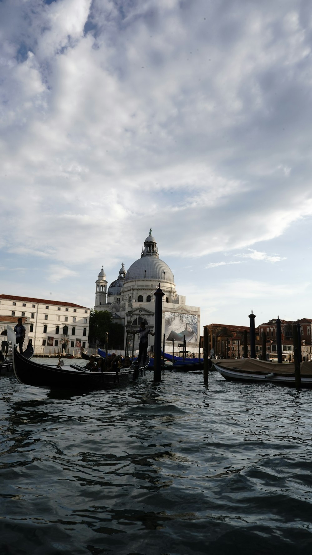 a couple of gondolas that are sitting in the water