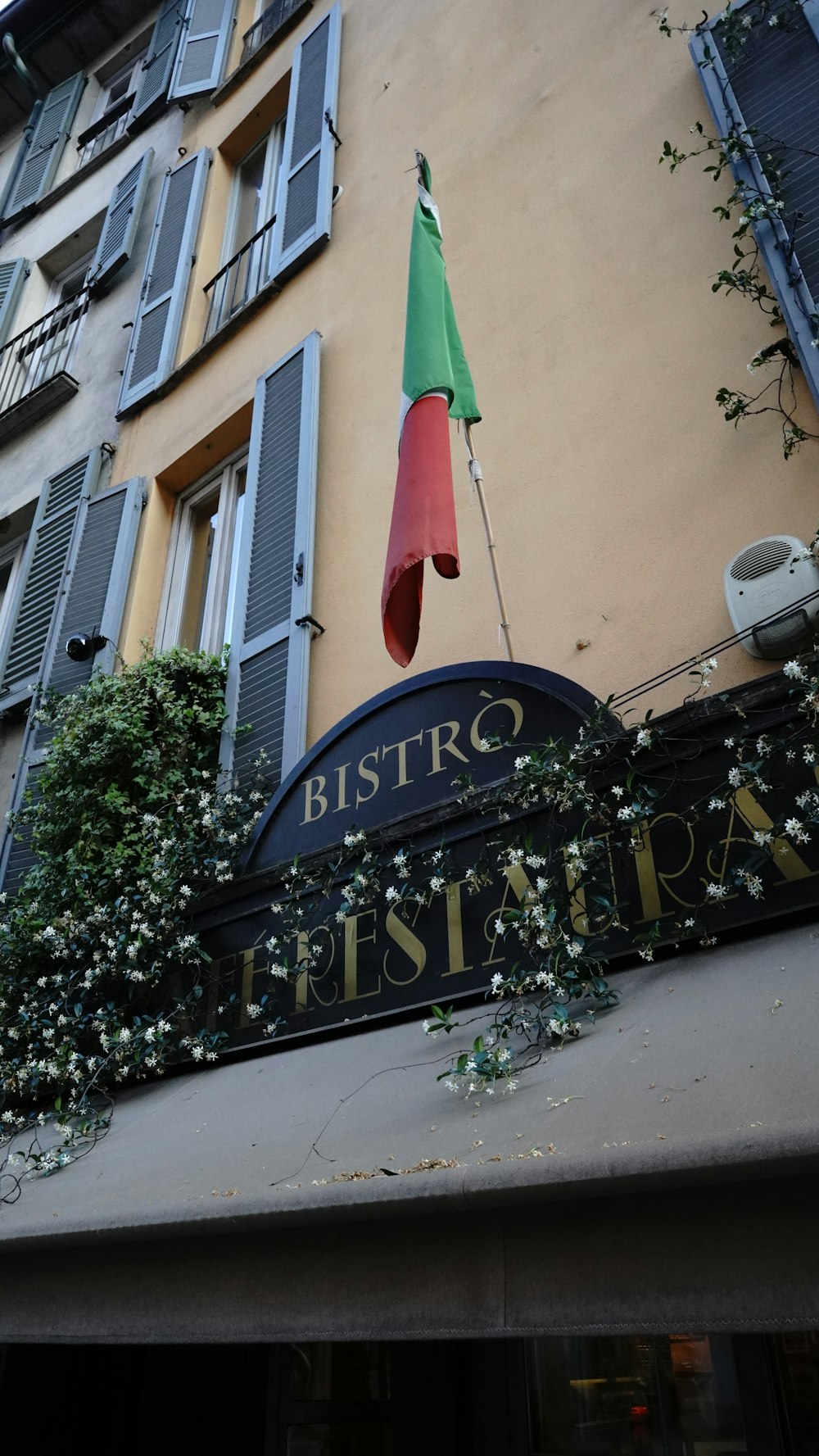 a building with a flag hanging off the side of it