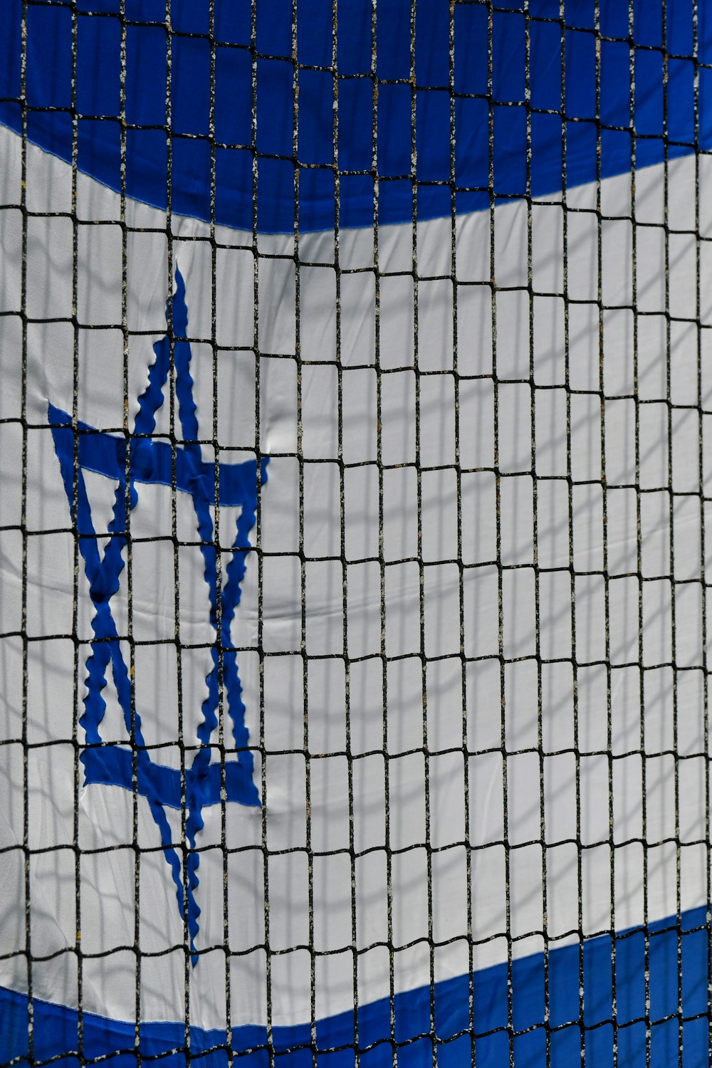 a close up of a net with a star of david on it