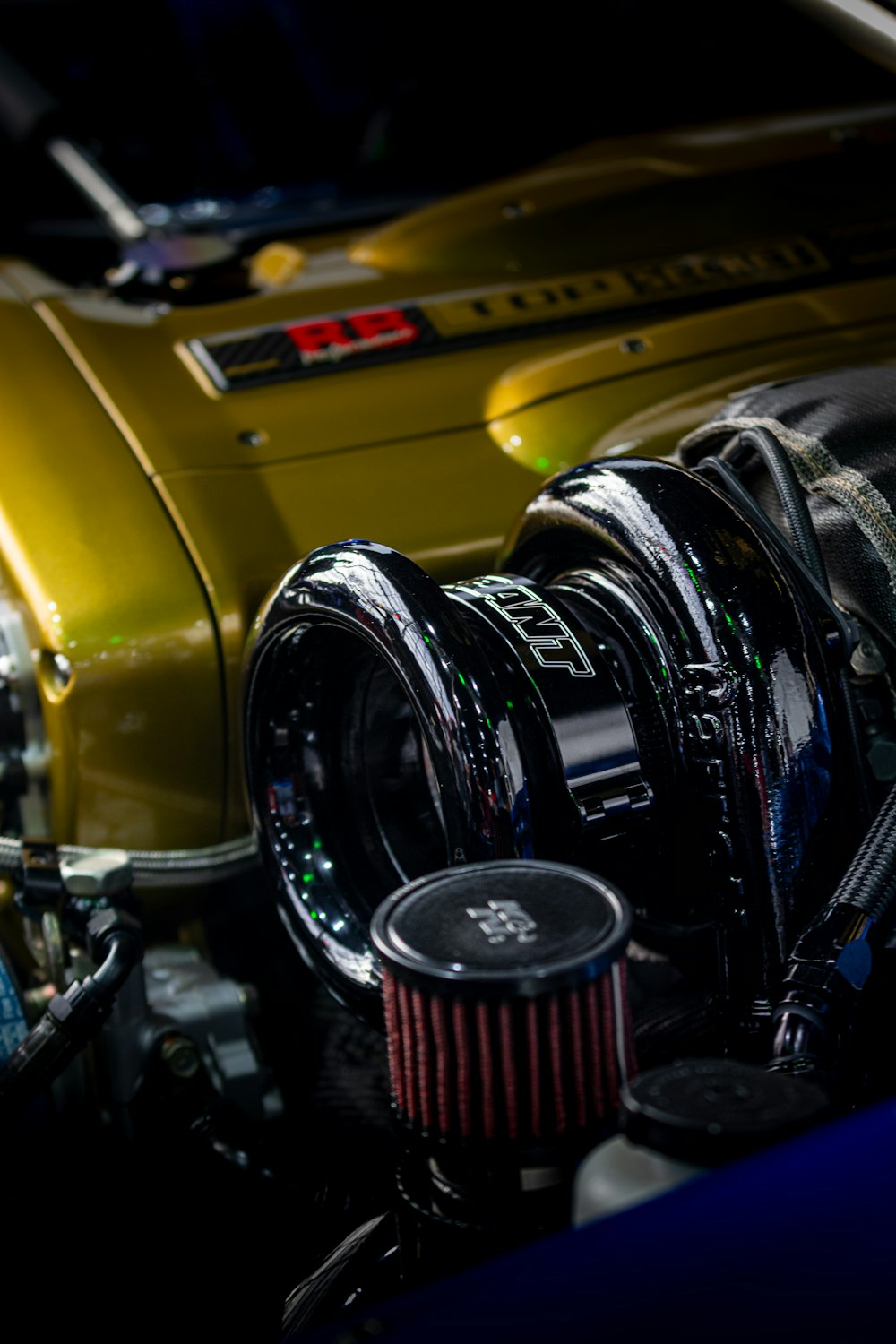 a close up of a car's engine and its hood