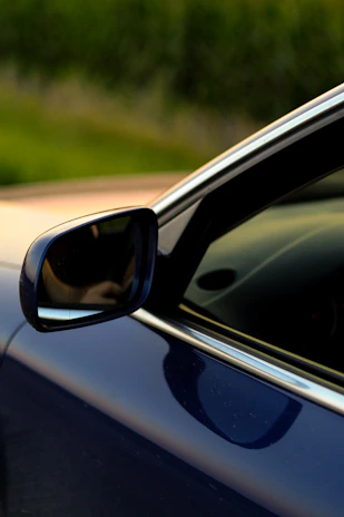 a close up of a car's side view mirror