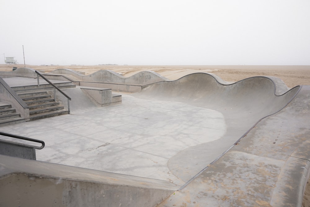 a skateboard park with ramps and ramps on a foggy day