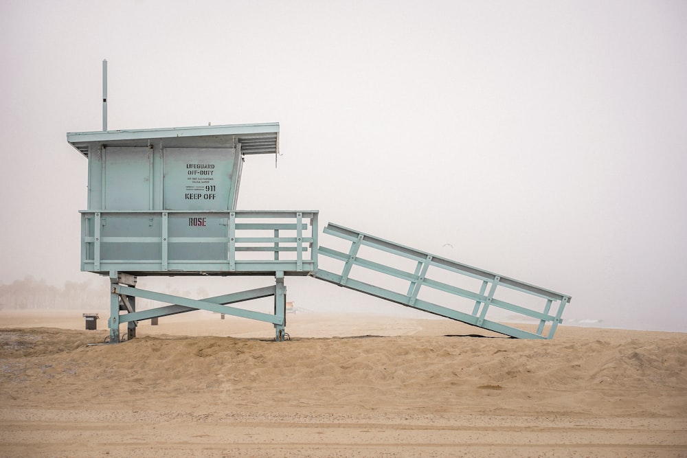 a lifeguard tower on a sandy beach