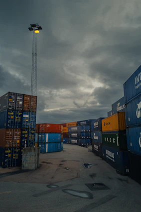a lot of containers that are sitting in the dirt