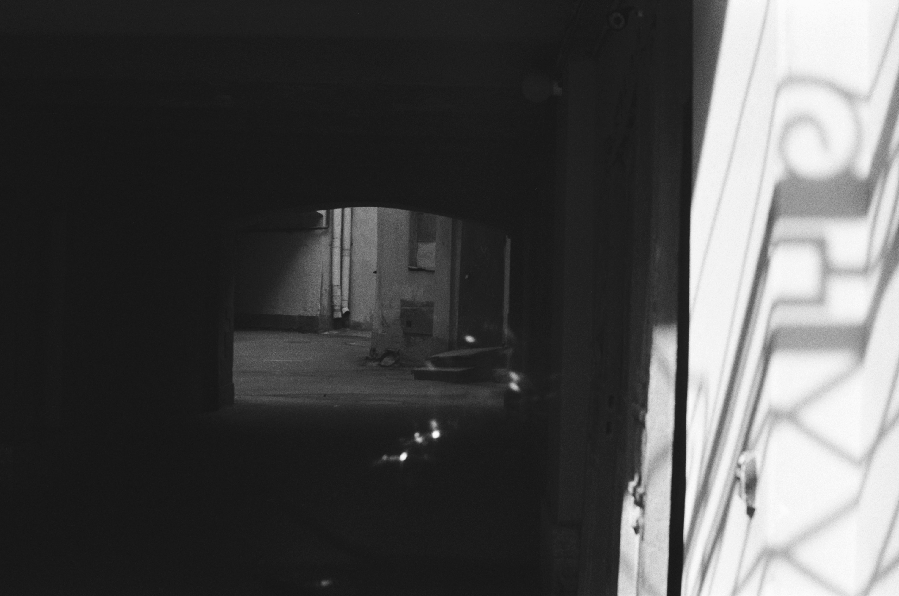 a black and white photo of a door way