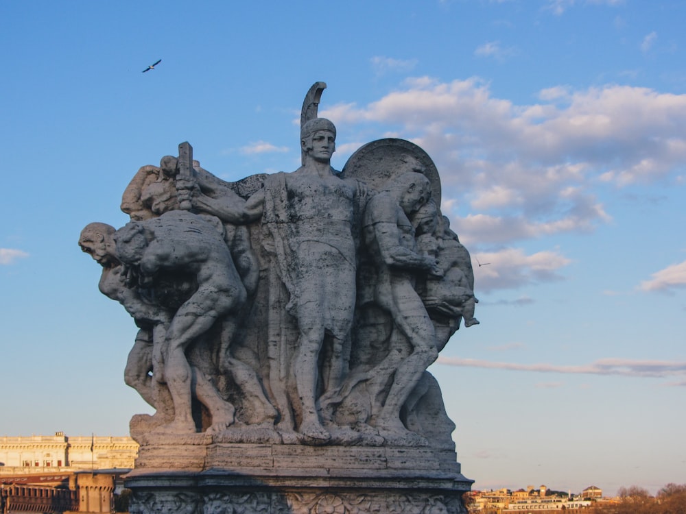 a statue of a man surrounded by other statues