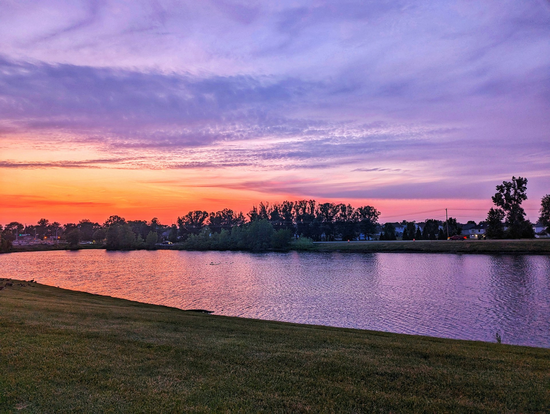 woman wearing yellow long-sleeved dress under white clouds and blue sky during daytime