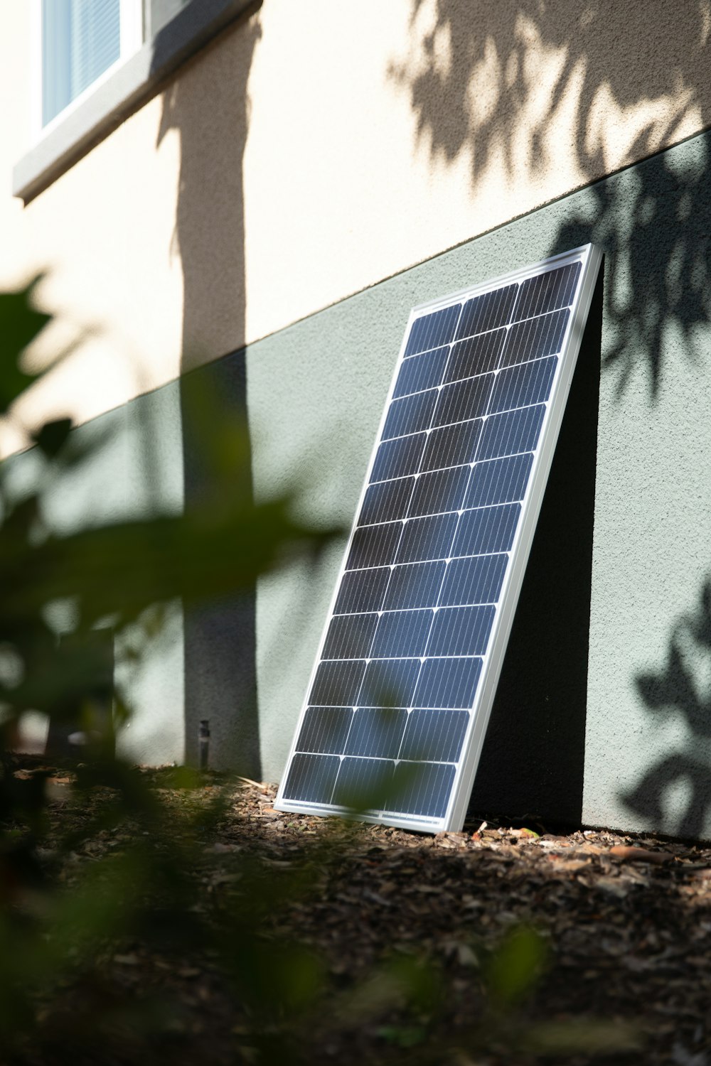 a small solar panel on the side of a building