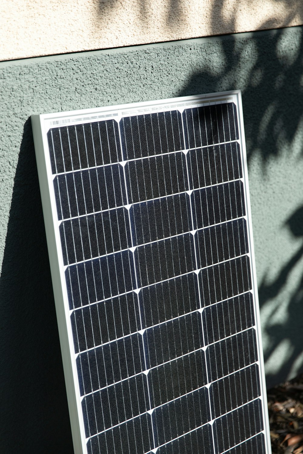 a solar panel mounted to the side of a building