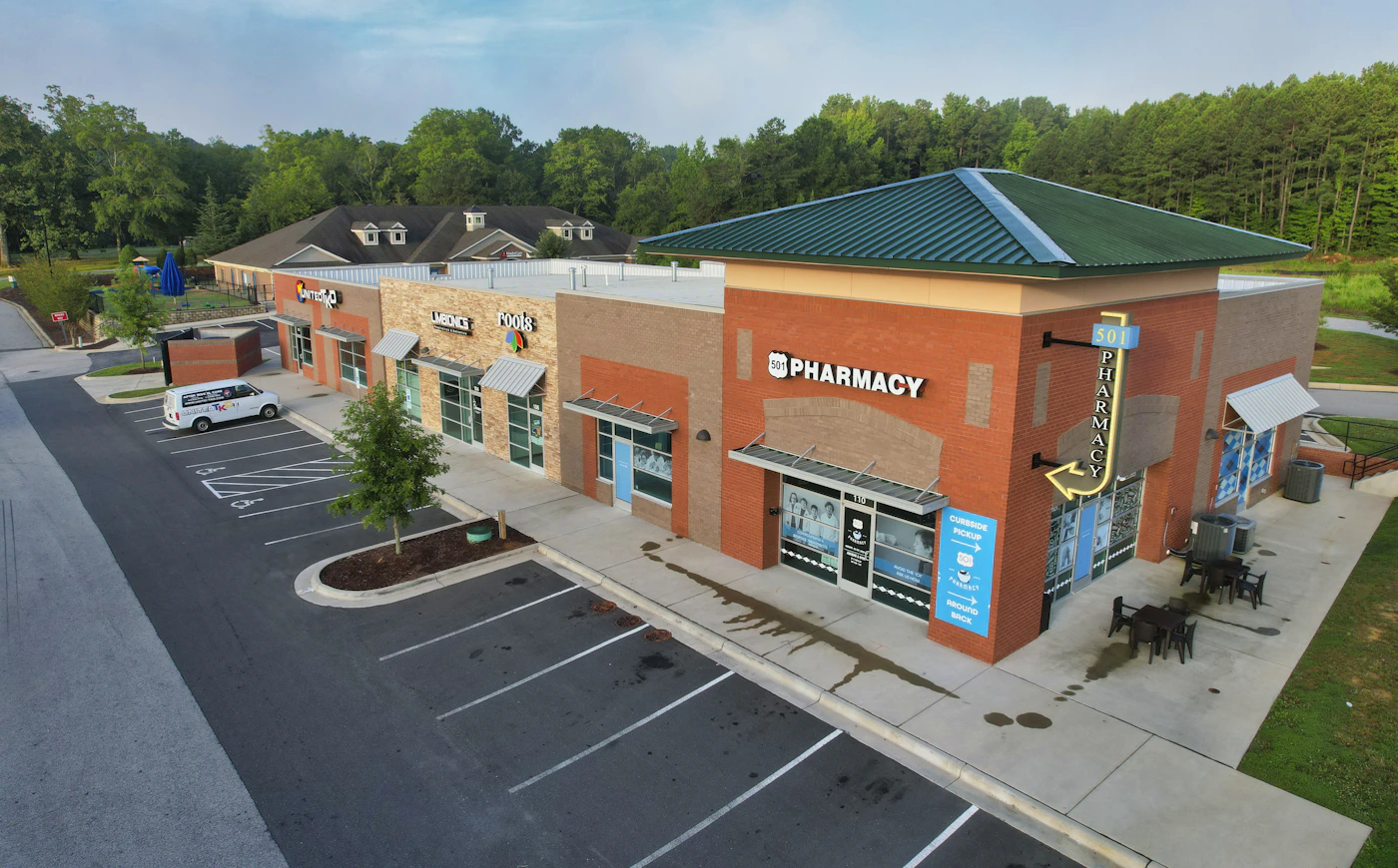 Open-air retail center with storefronts and convenient parking representing Jackson Premium Outlets