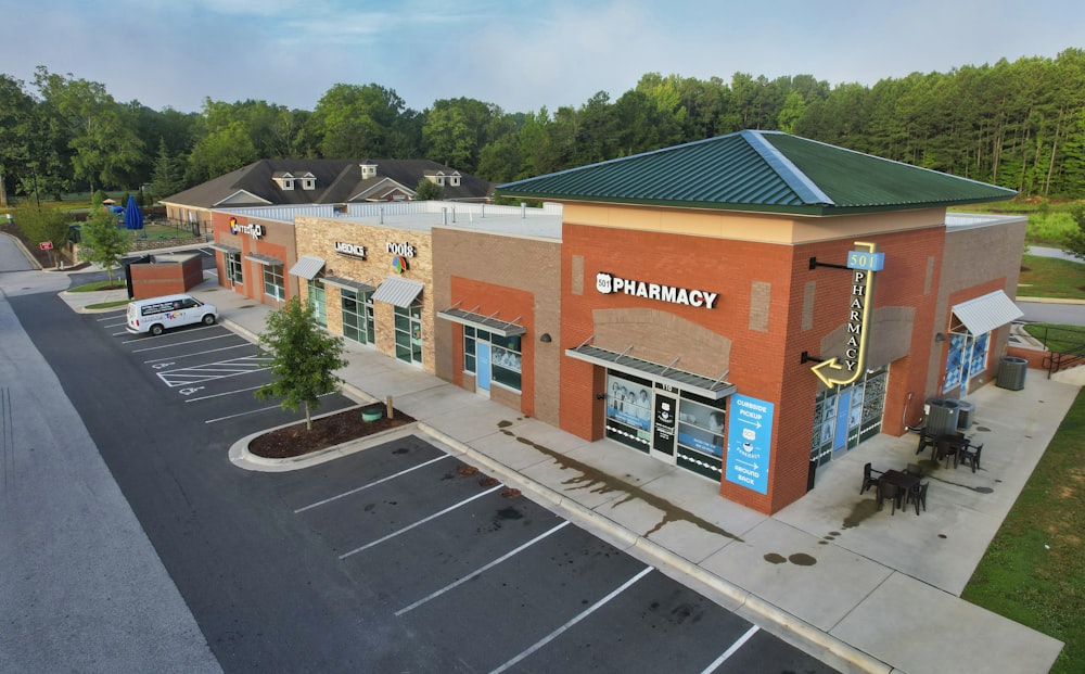 an aerial view of a building with a parking lot