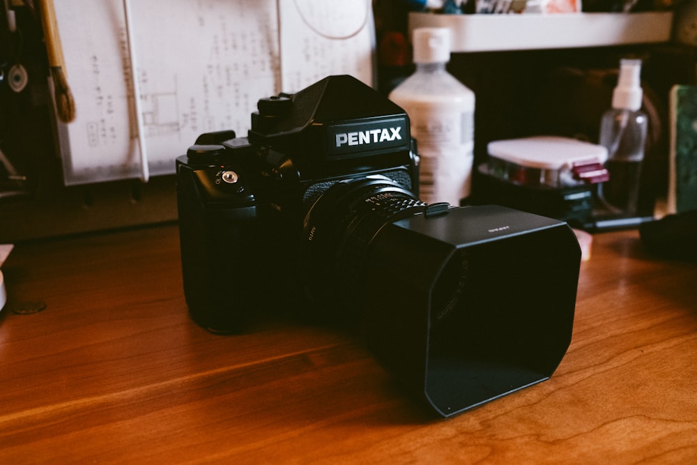 a camera sitting on top of a wooden table