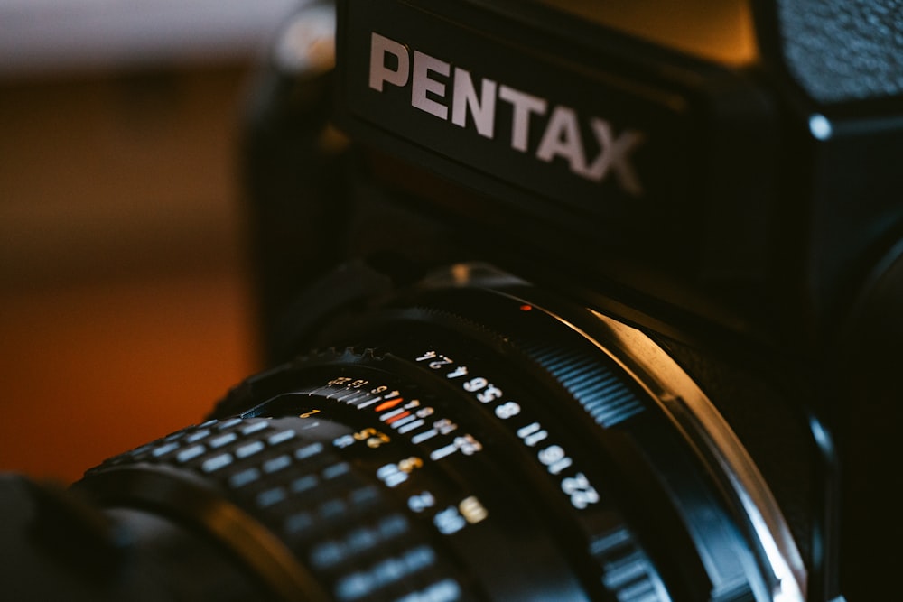 a close up of a camera with a pentax lens