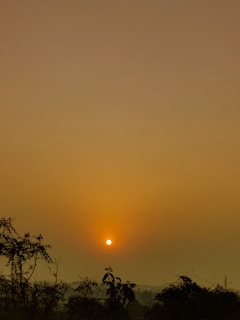 A serene landscape photograph capturing a sunset.