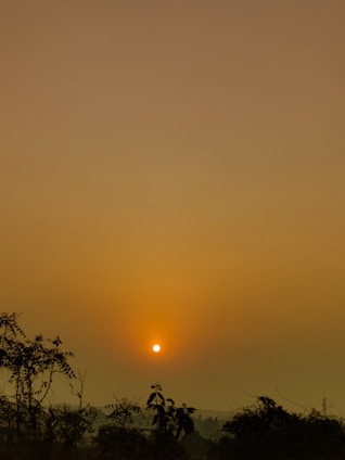 A vibrant framed photograph showcasing a serene landscape at sunset.
