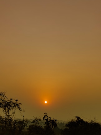 A serene landscape photograph capturing a sunset.