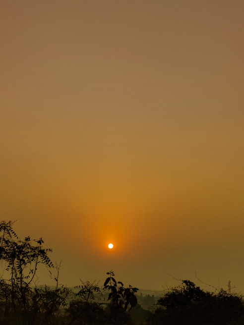 A serene landscape photograph capturing a sunset.