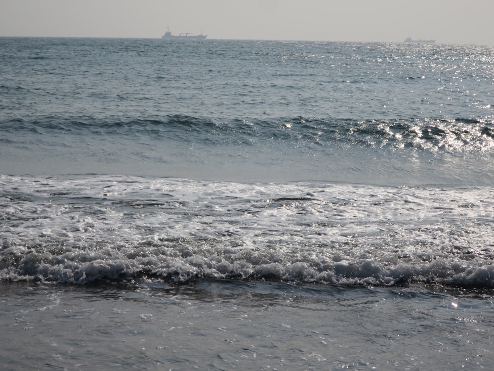 a body of water with a boat in the distance