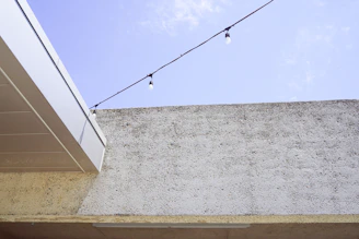 A modern patio structure with clean lines and minimalist design under soft evening light.