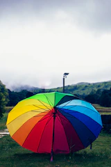 A golden umbrella shielding a vibrant green field symbolizing protection and freshness.