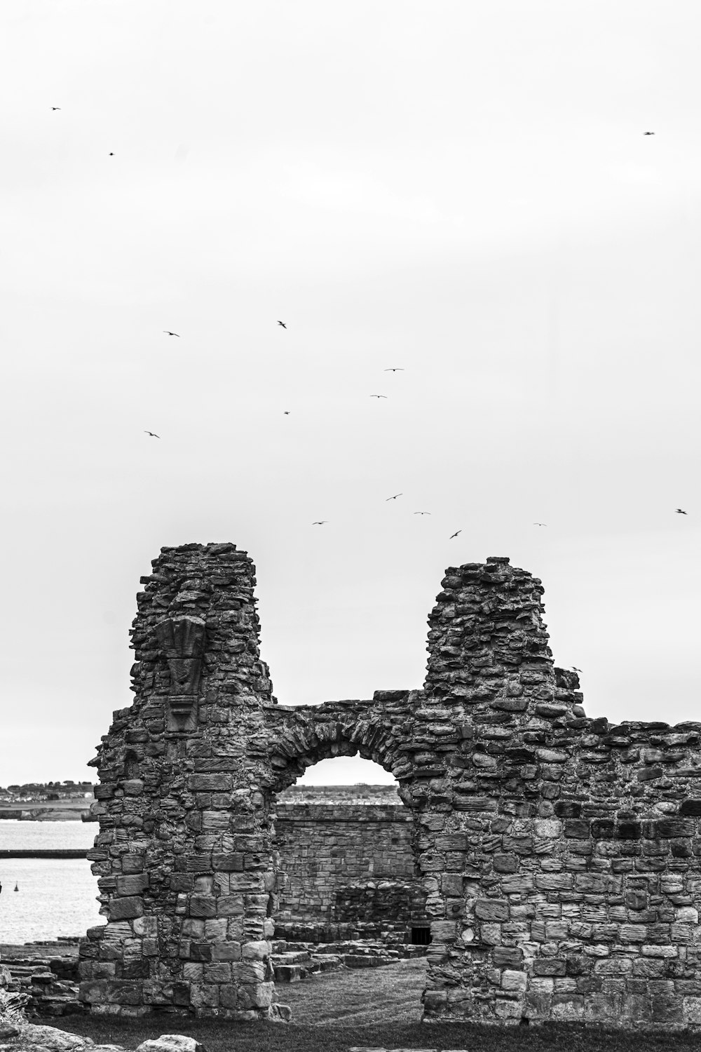 a black and white photo of a stone building