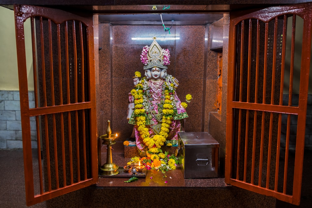 a shrine with a statue of a hindu god