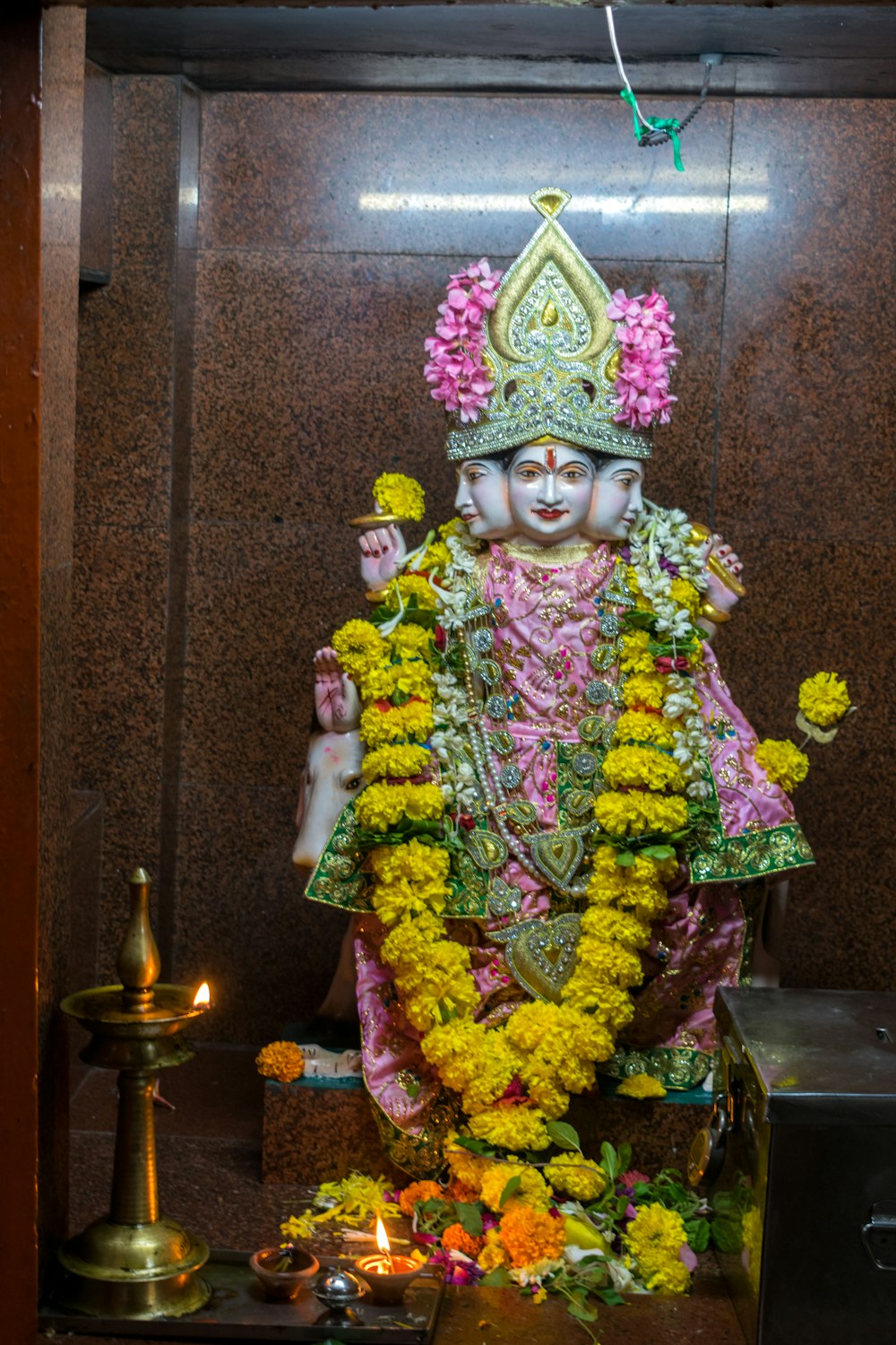 a statue of a hindu god in a temple