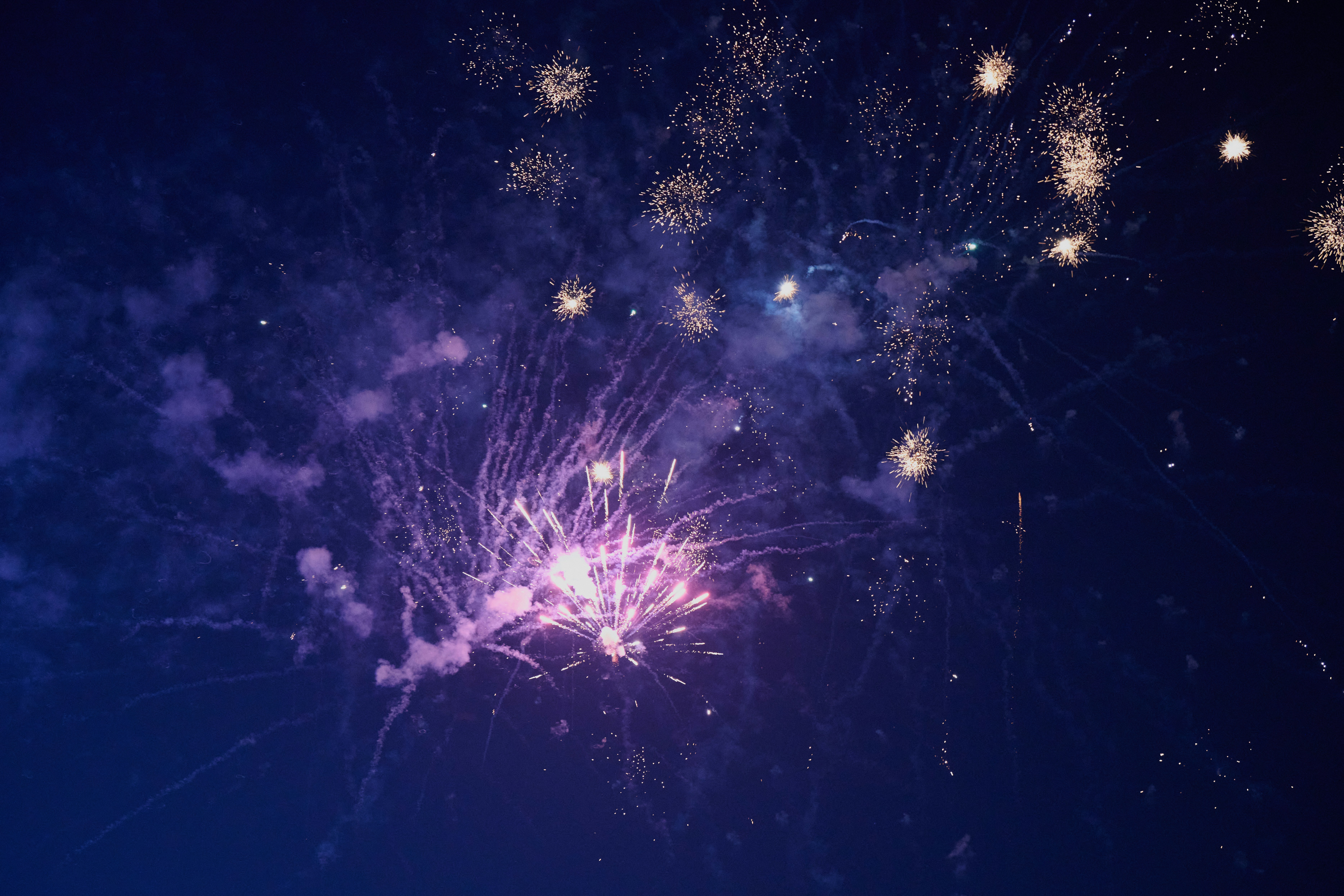 a bunch of fireworks are lit up in the night sky