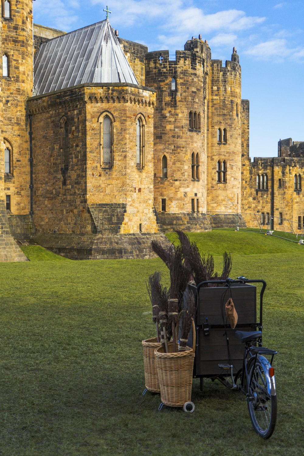 a bike parked in front of a castle