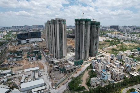 Cityscape with construction sites showcasing ongoing licensed projects.