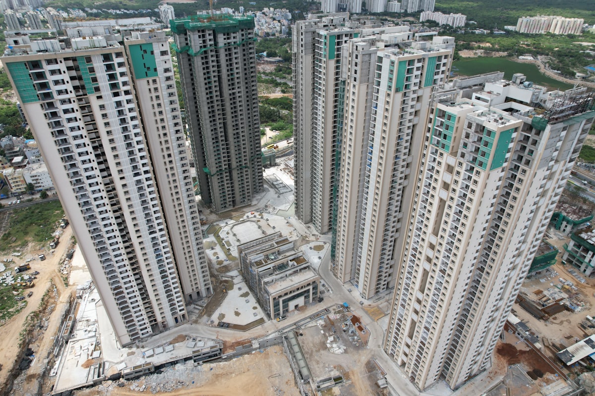 Modern apartment buildings under construction representing the historic wave of new rental supply