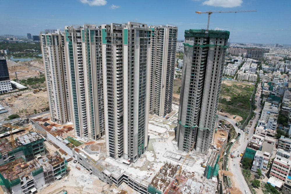 an aerial view of two tall buildings under construction
