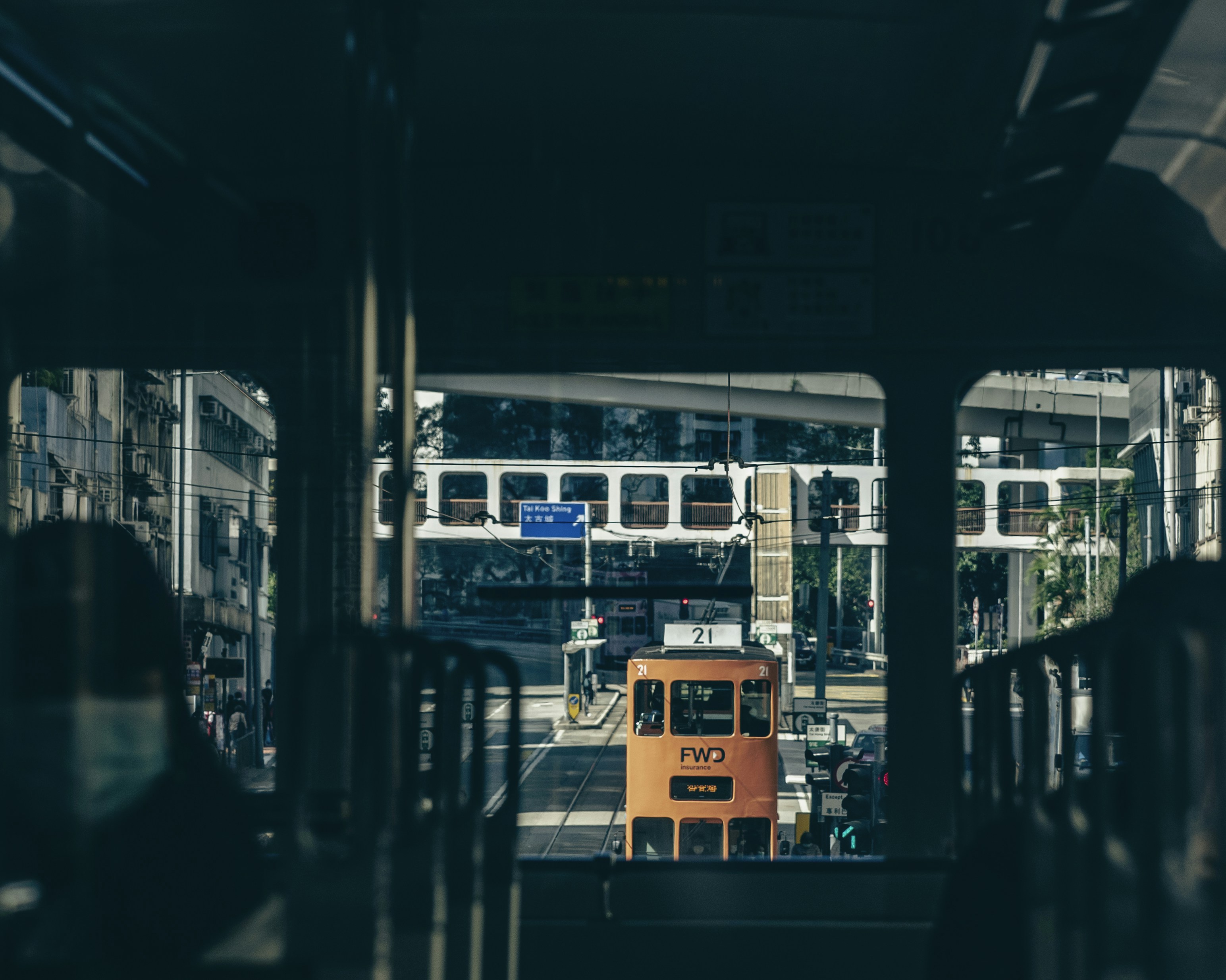 a view of a city from inside a bus