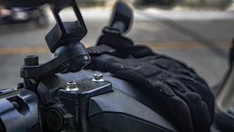 Close-up of a rugged motorcycle safety holster attached securely to a bike.