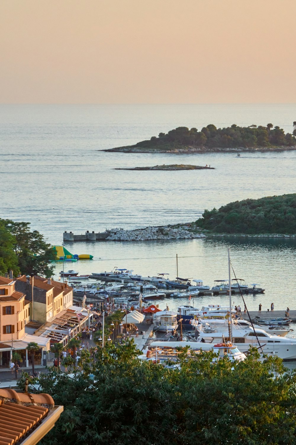 a harbor filled with lots of boats on top of a body of water