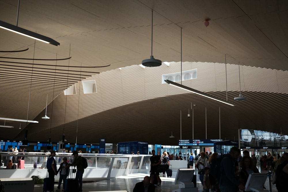 a group of people standing around a train station