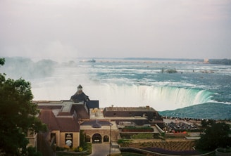 a view of a city with a waterfall in the background
