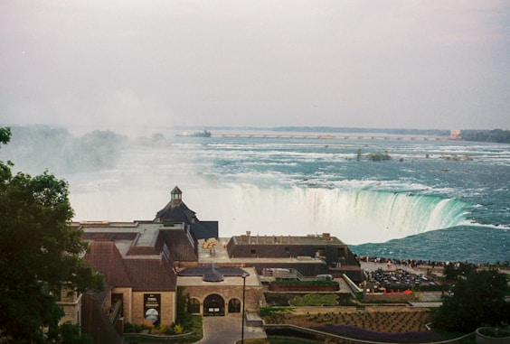 a view of a city with a waterfall in the background
