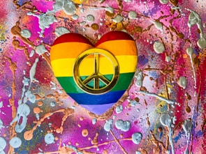 An abstract representation of love and identity using the lesbian pride flag colors.