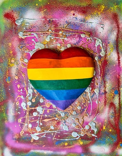 A vibrant digital illustration of a glowing rainbow heart surrounded by joyful animals from around the world.
