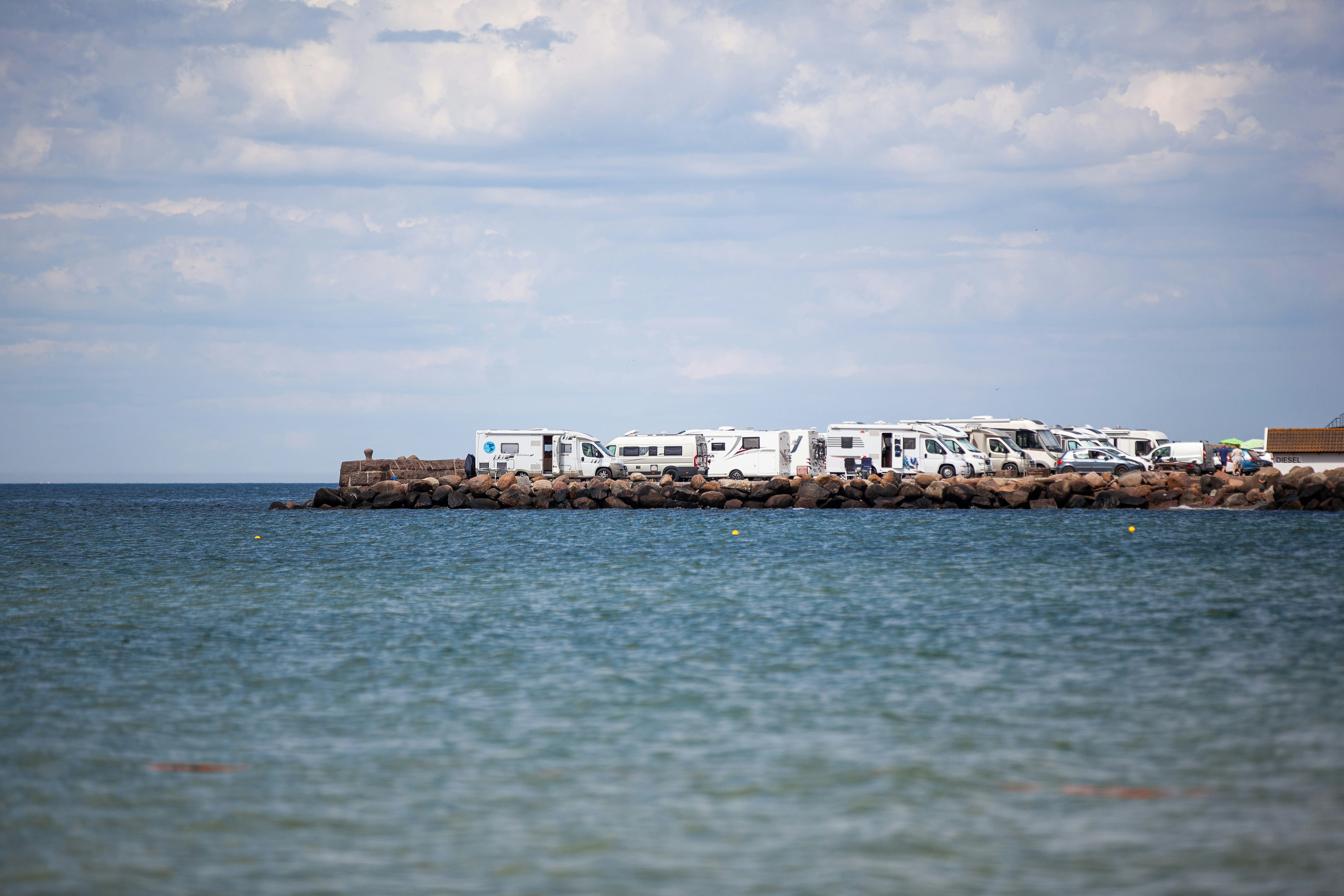 Coffin Bay, Australia (Oyster Capital) - Mobile homes parked closely together on a pier illustrating the paradox that the more people get out to enjoy the open environment with these huge vehicles the less open space there is left to enjoy.