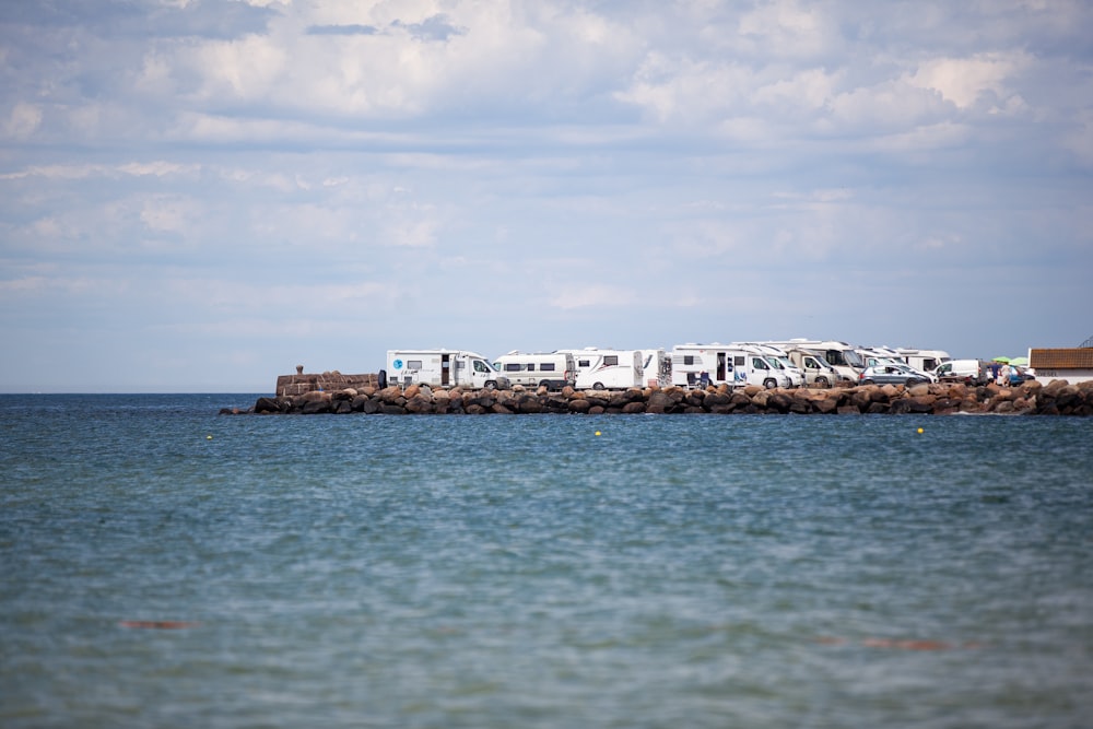 a group of rvs are parked on a rock outcropping in the